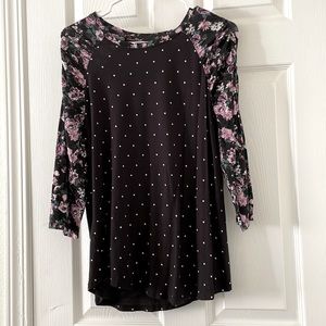 Black shirt and white polka dot medium length shirt